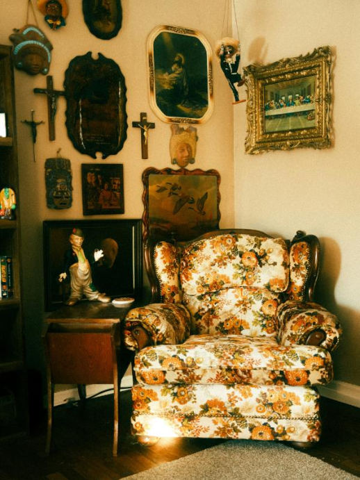 floral upholstered vintage chair with crucifix antique styling