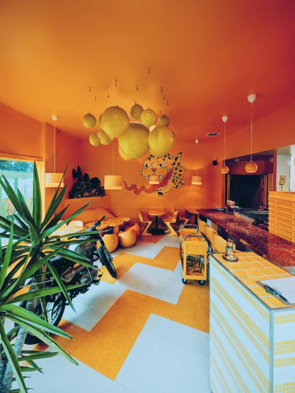 retro orange room with mid-century bubble chair décor